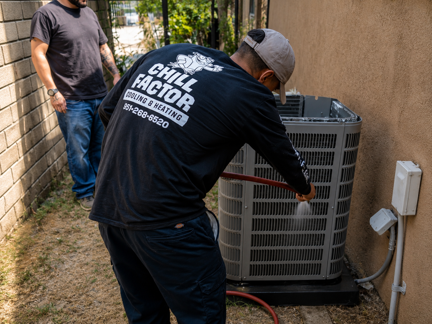 Professional AC maintenance technician in Inland Empire CA inspecting and servicing a residential air conditioning unit to improve cooling performance.